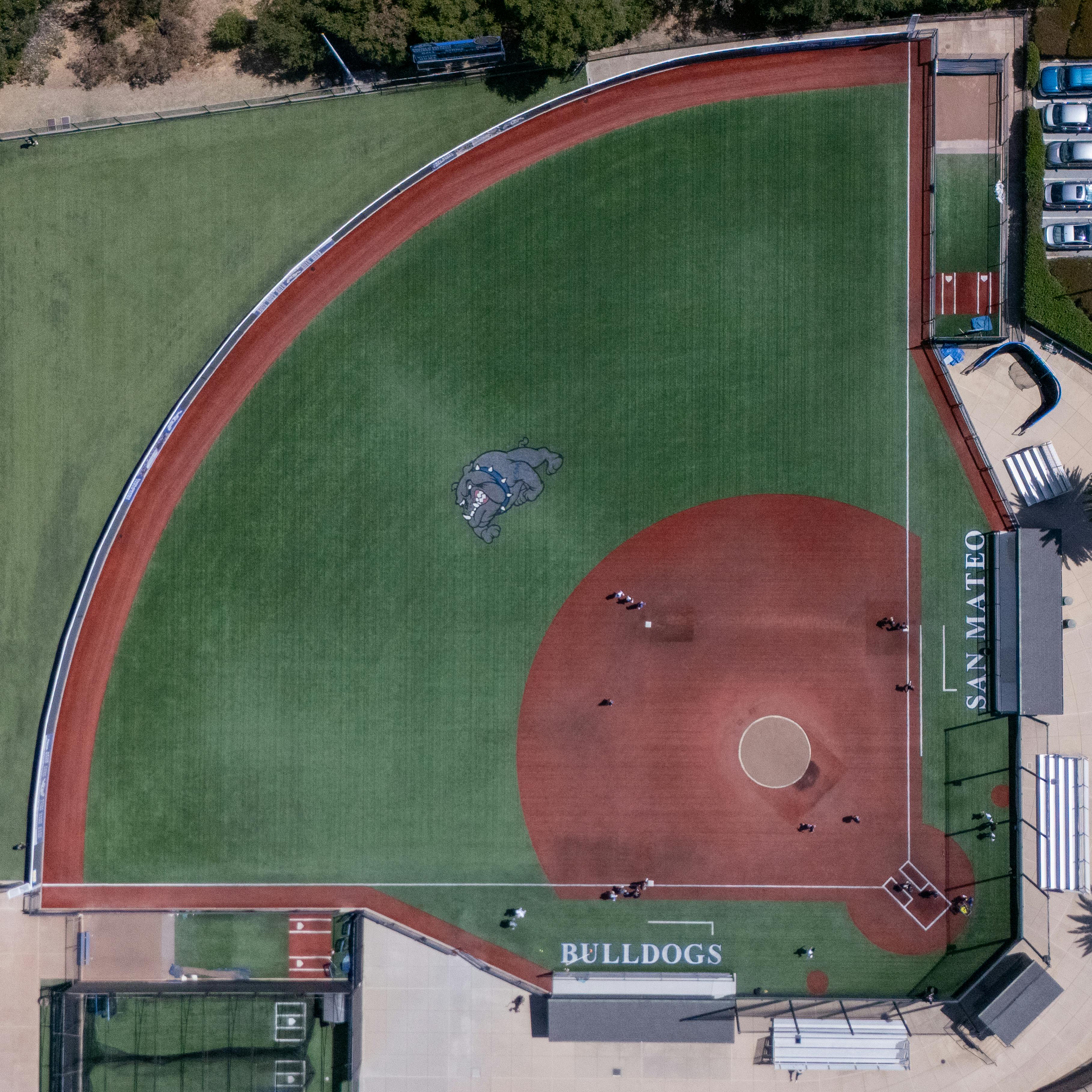 Aerial view of San Mateo baseball field with bright green turf and vibrant details.